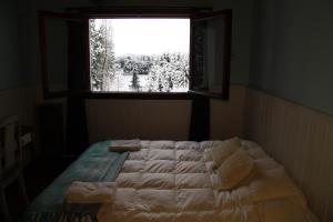 Una cama o camas en una habitación de Hosteria Las Cartas