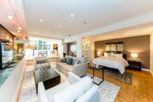 a large living room with a bed and a couch at Chelsea Pines Inn in New York