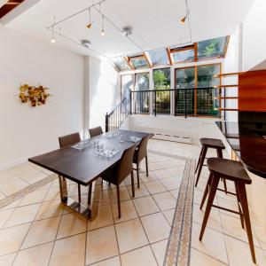 a dining room with a table and chairs at Chelsea Pines Inn in New York