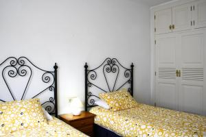 Łóżko lub łóżka w pokoju w obiekcie VILLA MANUELA by Buenavilla