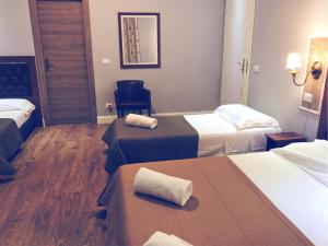 Postel nebo postele na pokoji v ubytování Hotel Aida