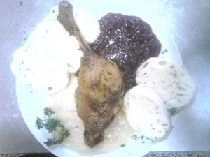 a plate of food with meat and ice cream at U Pastorku in Račice