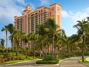 
a large building with palm trees and palm trees at The Cove at Atlantis in Nassau
