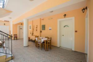 a dining room with a table and chairs at Summer Dream in Vlachata
