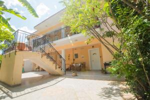 a courtyard of a house with a staircase at Summer Dream in Vlachata