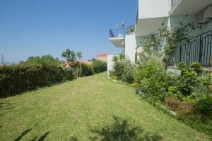 an empty yard next to a building at Summer Dream in Vlachata