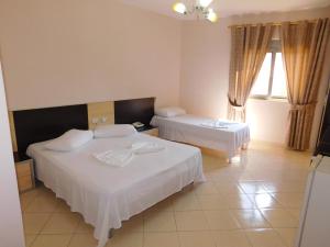 Postel nebo postele na pokoji v ubytování Hotel Continental
