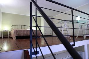 a bedroom with a bed in a room at Palazzo Ossuna in Trapani