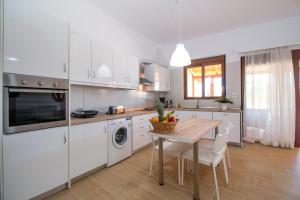 Kuchyň nebo kuchyňský kout v ubytování Emerald Dream Apartment