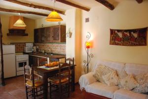 a living room with a couch and a table at Casa Africa in Mecina Fondales +26 photos