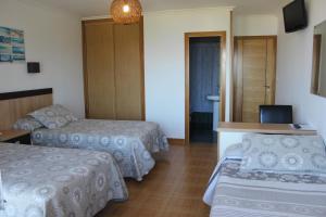 Posteľ alebo postele v izbe v ubytovaní Hotel Estrella del Mar