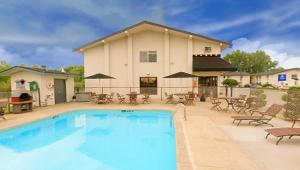 a swimming pool in front of a house at Valued Stay Madison in Madison