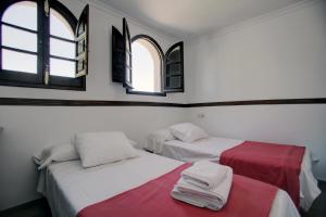 Tempat tidur dalam kamar di Casa Rondeña