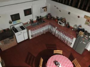 Kuchyň nebo kuchyňský kout v ubytování Hostal Casa Lantana