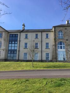 a building with windows on the side of a road at Silverhill House Apartment in Enniskillen