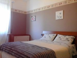 A bed or beds in a room at Appartamento del Parco