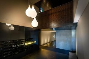 a tasting room at the pomegranate restaurant with lights at Tribeca Serviced Apartments in Melbourne