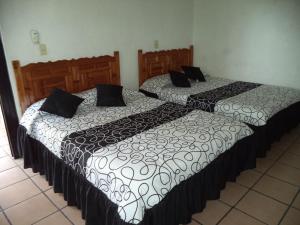 Hotel Ocampo tesisinde bir odada yatak veya yataklar