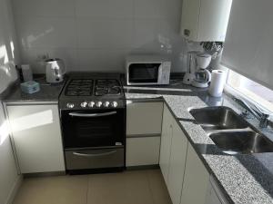Kjøkken eller kjøkkenkrok på Marco Polo Platinum Apartamento