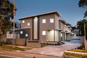 a row of houses on the side of a street at Wallsend Executive Apartments in Newcastle