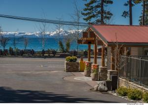 a building with a red roof next to a street at Firelite Lodge in Tahoe Vista