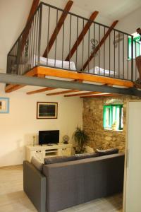 a living room with a couch and a loft at Holiday Home Anna in Skradin