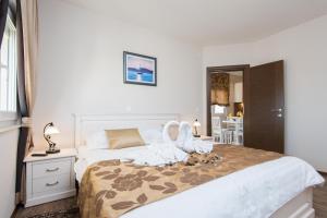 Posteľ alebo postele v izbe v ubytovaní Apartments Villa Stella