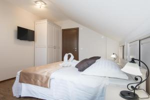 Posteľ alebo postele v izbe v ubytovaní Apartments Villa Stella