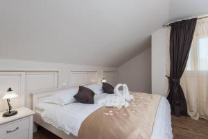 Posteľ alebo postele v izbe v ubytovaní Apartments Villa Stella