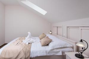 Posteľ alebo postele v izbe v ubytovaní Apartments Villa Stella
