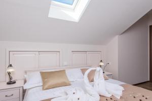 Posteľ alebo postele v izbe v ubytovaní Apartments Villa Stella