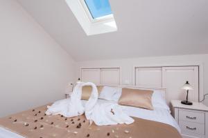Posteľ alebo postele v izbe v ubytovaní Apartments Villa Stella