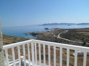 a view of the ocean from the balcony of a house at Milo Milo Suites in Mandrakia