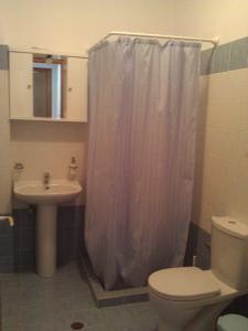 Kylpyhuone majoituspaikassa Agnanti Apartments