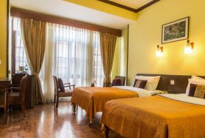 Cama ou camas em um quarto em Hotel Excelsior