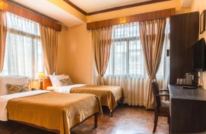 Cama ou camas em um quarto em Hotel Excelsior