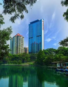 
a city with tall buildings and a river at Soluxe Hotel Guangzhou in Guangzhou
