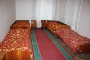 Ένα ή περισσότερα κρεβάτια σε δωμάτιο στο Firuza Hostel