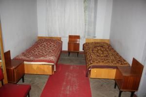 Ένα ή περισσότερα κρεβάτια σε δωμάτιο στο Firuza Hostel