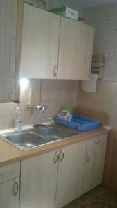 a kitchen with a sink and a counter top at All-Inn K&ouml;re in Kisk&ouml;re