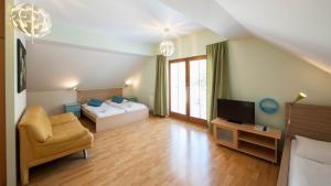Posteľ alebo postele v izbe v ubytovaní Hotel Garni Pod Skalkou