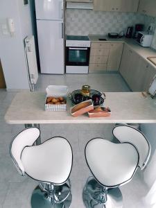 Kuchyň nebo kuchyňský kout v ubytování Bourlis Apartments