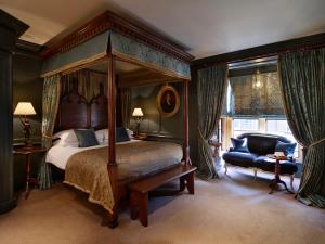 a bedroom with a bed and a canopy at Hazlitt's in London