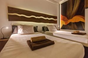 
A bed or beds in a room at epicenter SANTACRUZ
