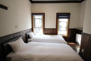 En eller flere senge i et værelse på Hakodate Classic Hotels