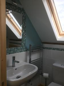 A bathroom at Honeycomb House Apartments 