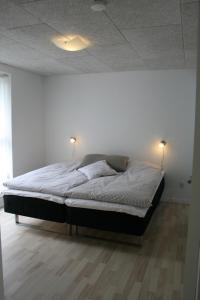 En eller flere senge i et værelse på Sov Godt i Arnborg Bed & Breakfast