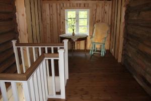 a hallway of a cabin with a chair and a window at Molandstveit in Osestad