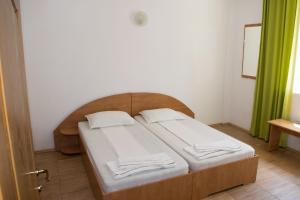 Postel nebo postele na pokoji v ubytování Tiberius Residence