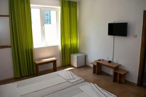 TV a/nebo společenská místnost v ubytování Tiberius Residence